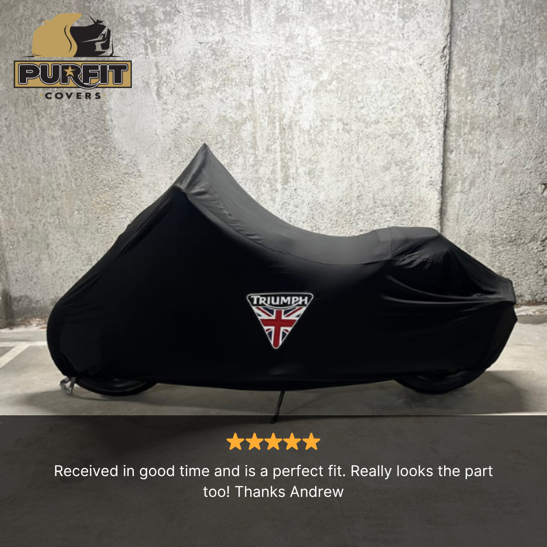 Black custom indoor motorcycle cover with Triumph logo, cut to fit the bike